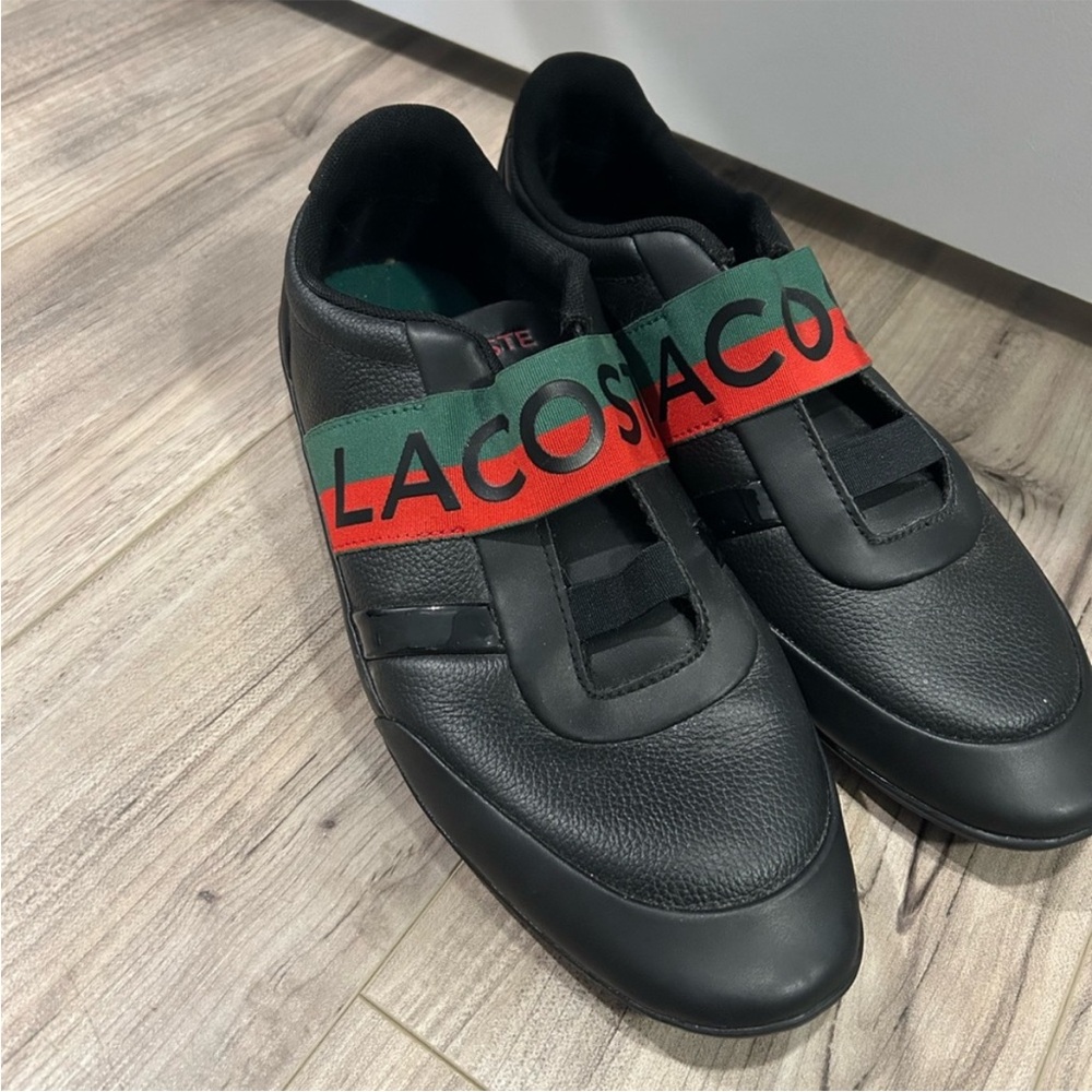 Lacoste Black slip ons with Red and Green Straps